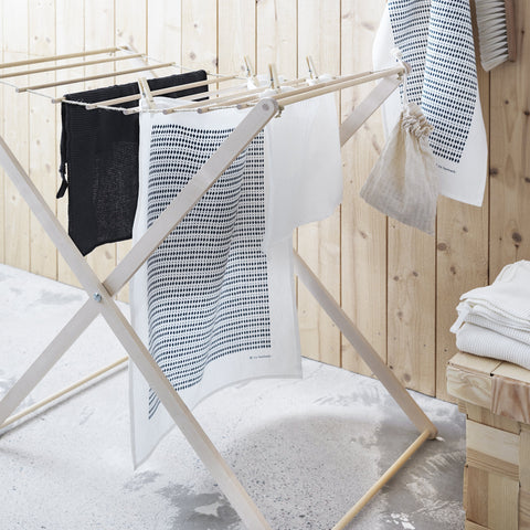This beautiful, simple and practical wood drying rack is perfect for drying laundry in small spaces, on the deck or in front of the fire.  Conveniently folds away when not in use.